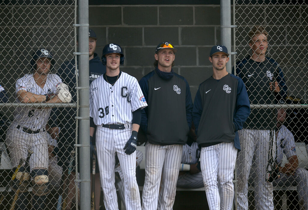 Columbia College men's baseball team stand in the dugout